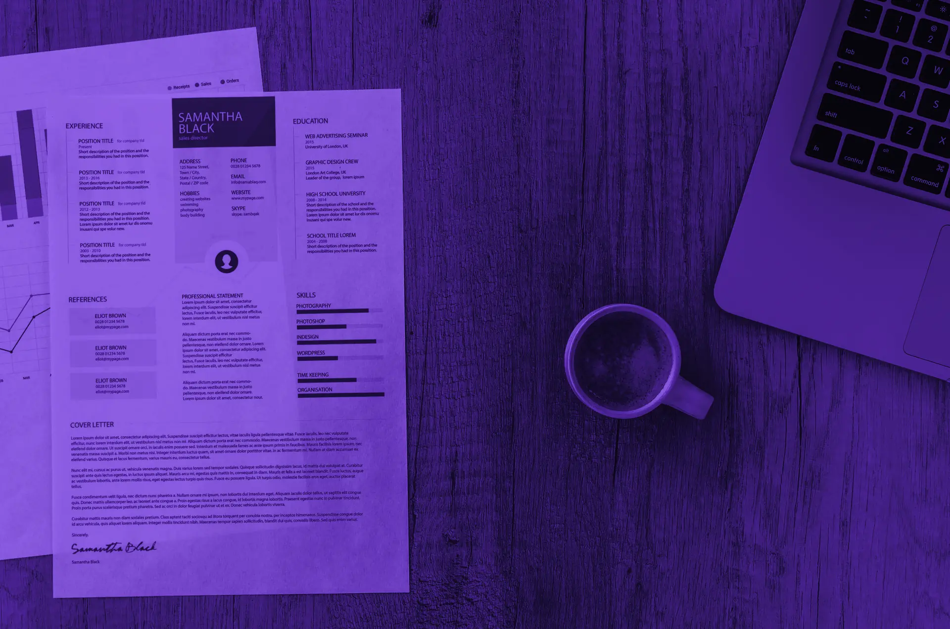 A résumé and a laptop on a desk